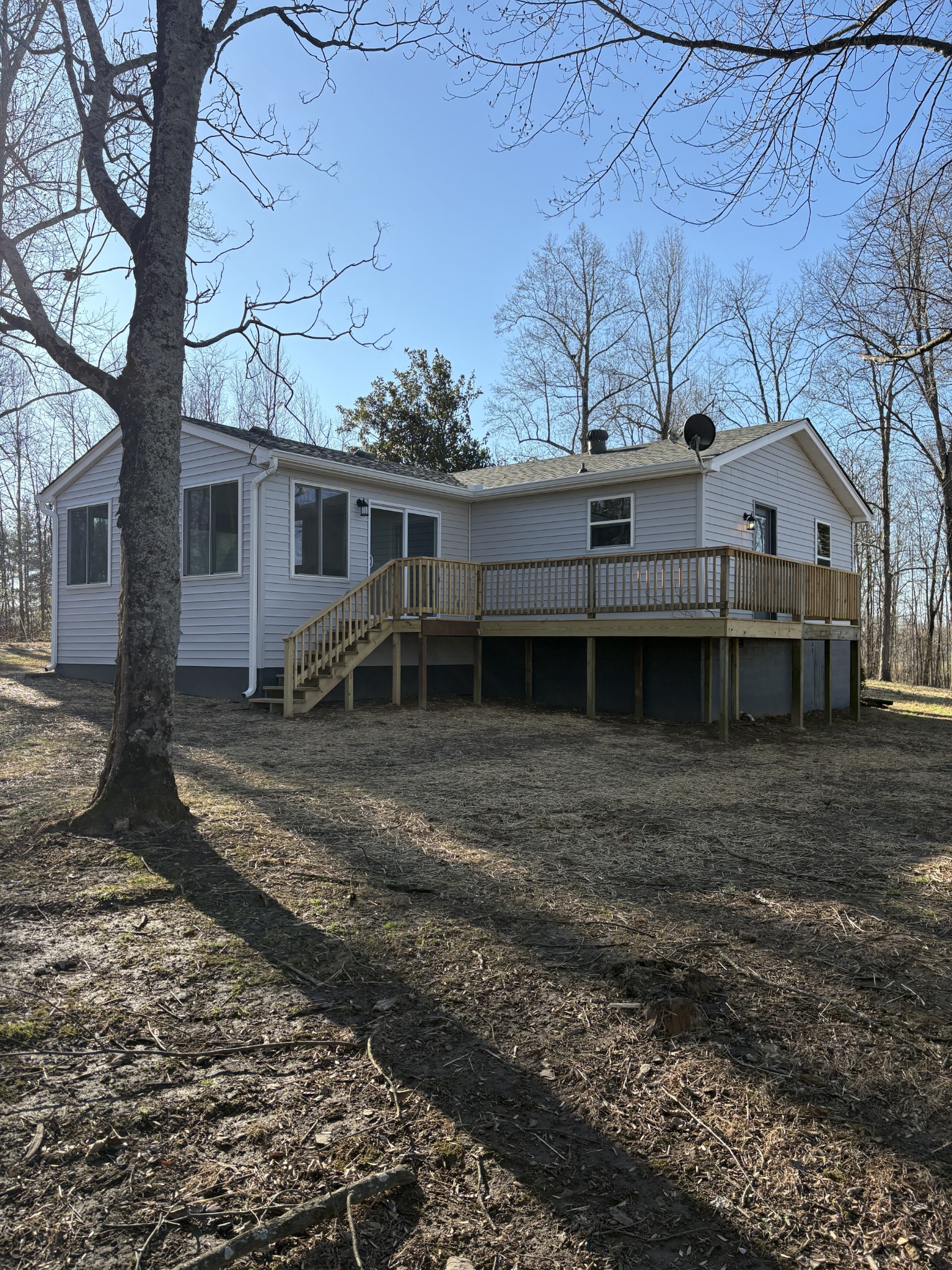 1358 Hurricane Ridge Road Smithville, TN 37166 - Photo 2 of 29 a front view of a house with garden