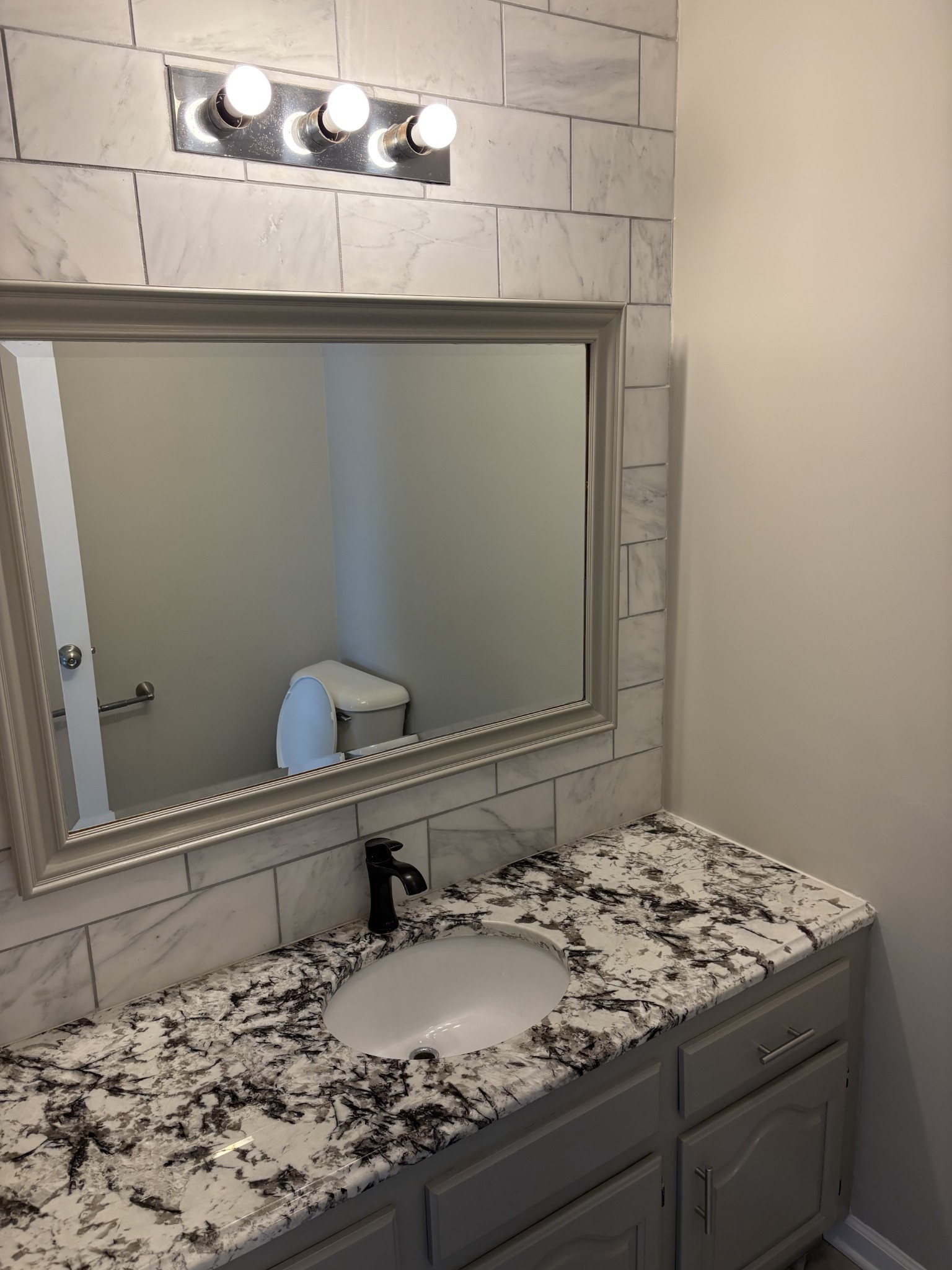 1358 Hurricane Ridge Road Smithville, TN 37166 - Photo 5 of 29 a bathroom with a granite countertop sink and a mirror