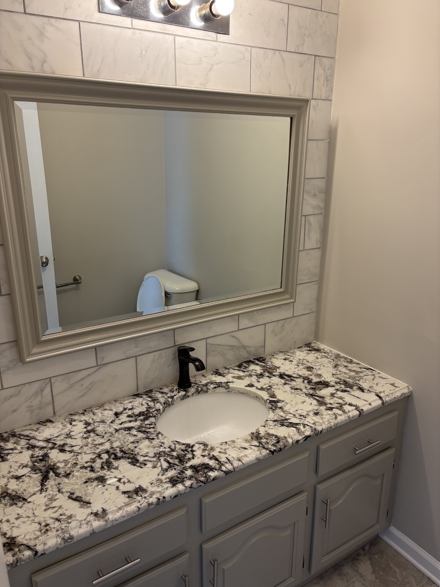1358 Hurricane Ridge Road Smithville, TN 37166 - Photo 7 of 29 a bathroom with a sink and a mirror