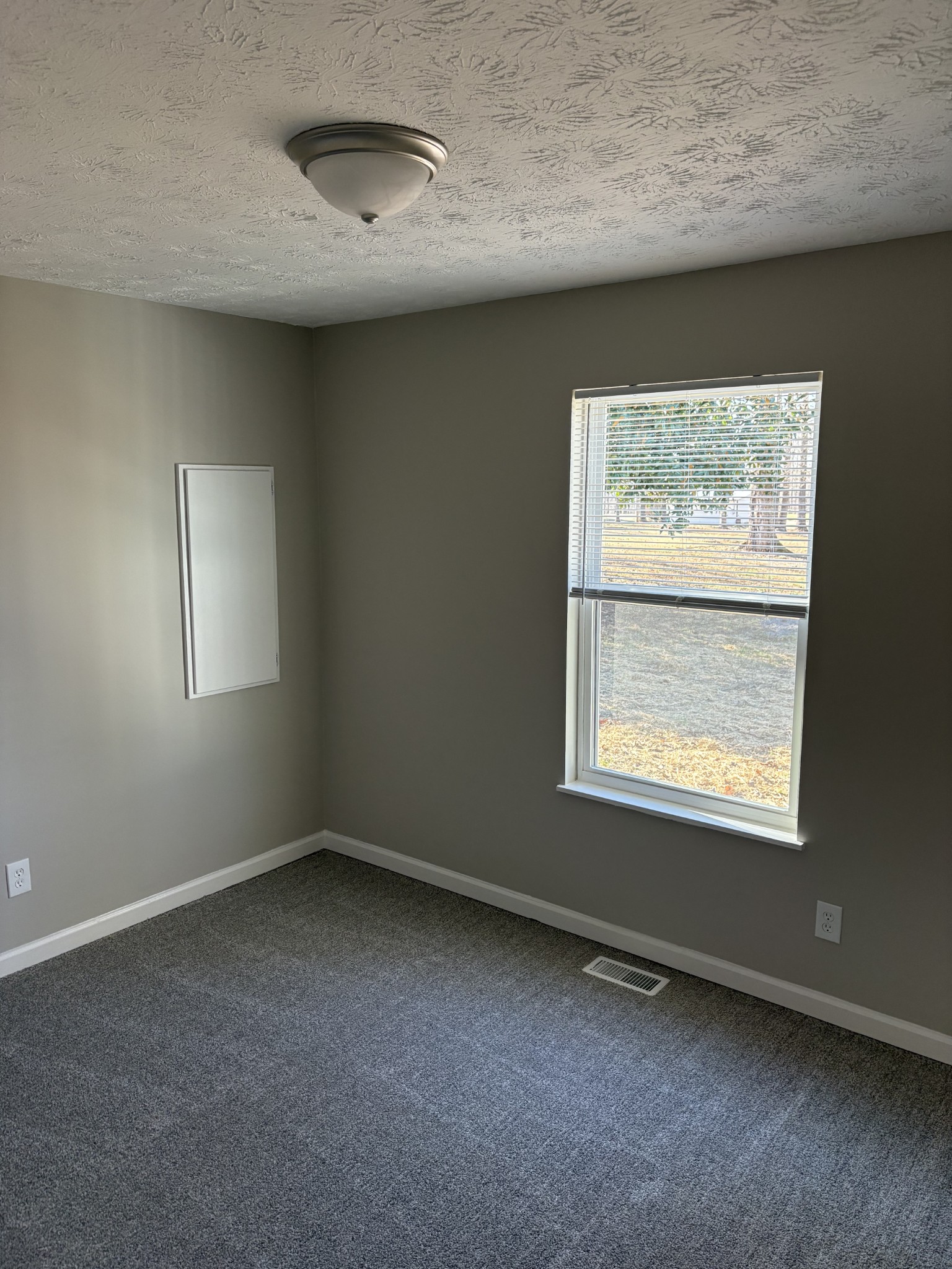 1358 Hurricane Ridge Road Smithville, TN 37166 - Photo 9 of 29 an empty room with a window
