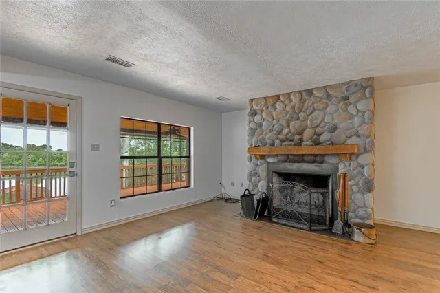 a view of a livingroom with furniture and a fireplace