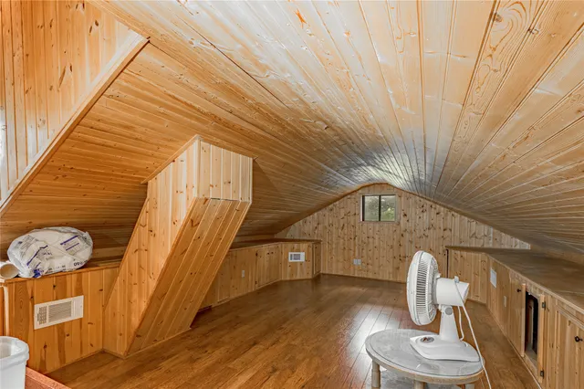 a room with furniture and gym equipment