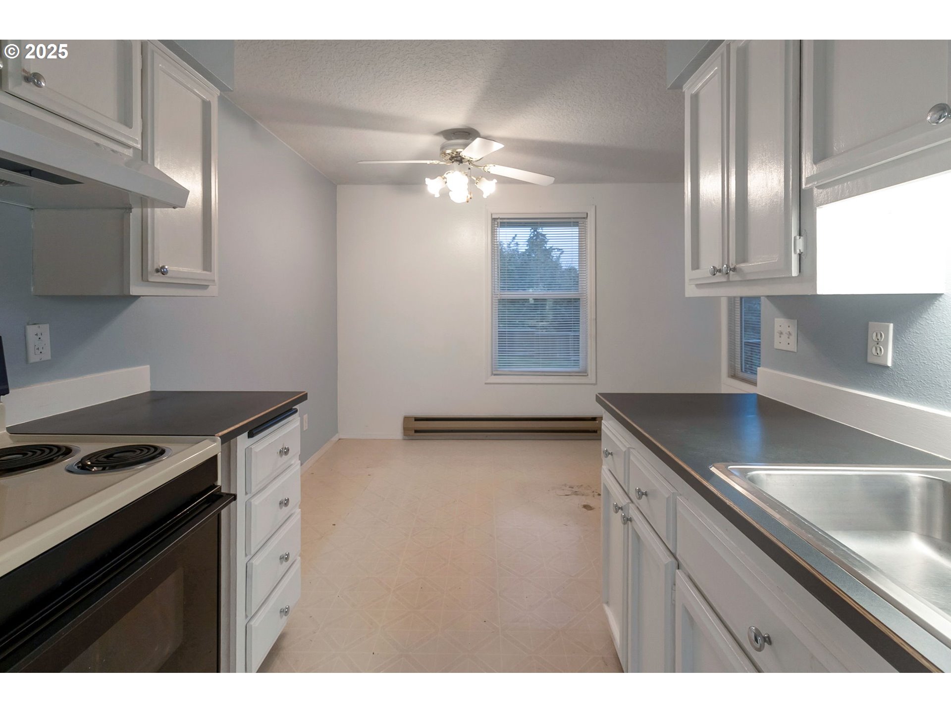 8524 Southwest Mohawk Street Tualatin, OR 97062 - Photo 11 of 30 a kitchen with granite countertop a sink stainless steel appliances and cabinets