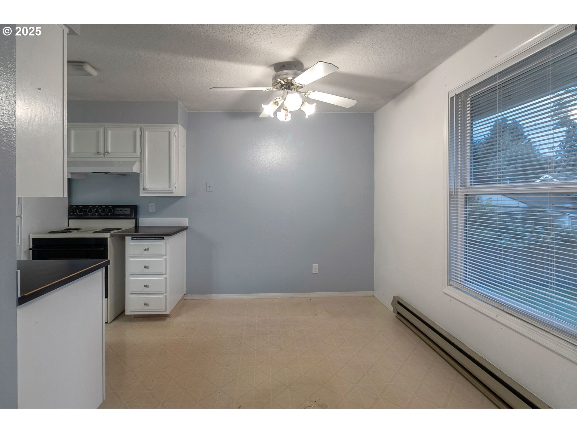 8524 Southwest Mohawk Street Tualatin, OR 97062 - Photo 8 of 30 a kitchen with stainless steel appliances cabinets a window and a sink