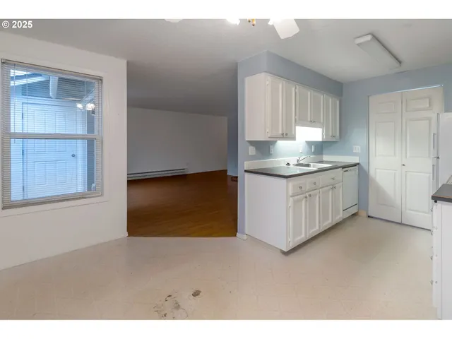 a kitchen with stainless steel appliances granite countertop a sink and a cabinets