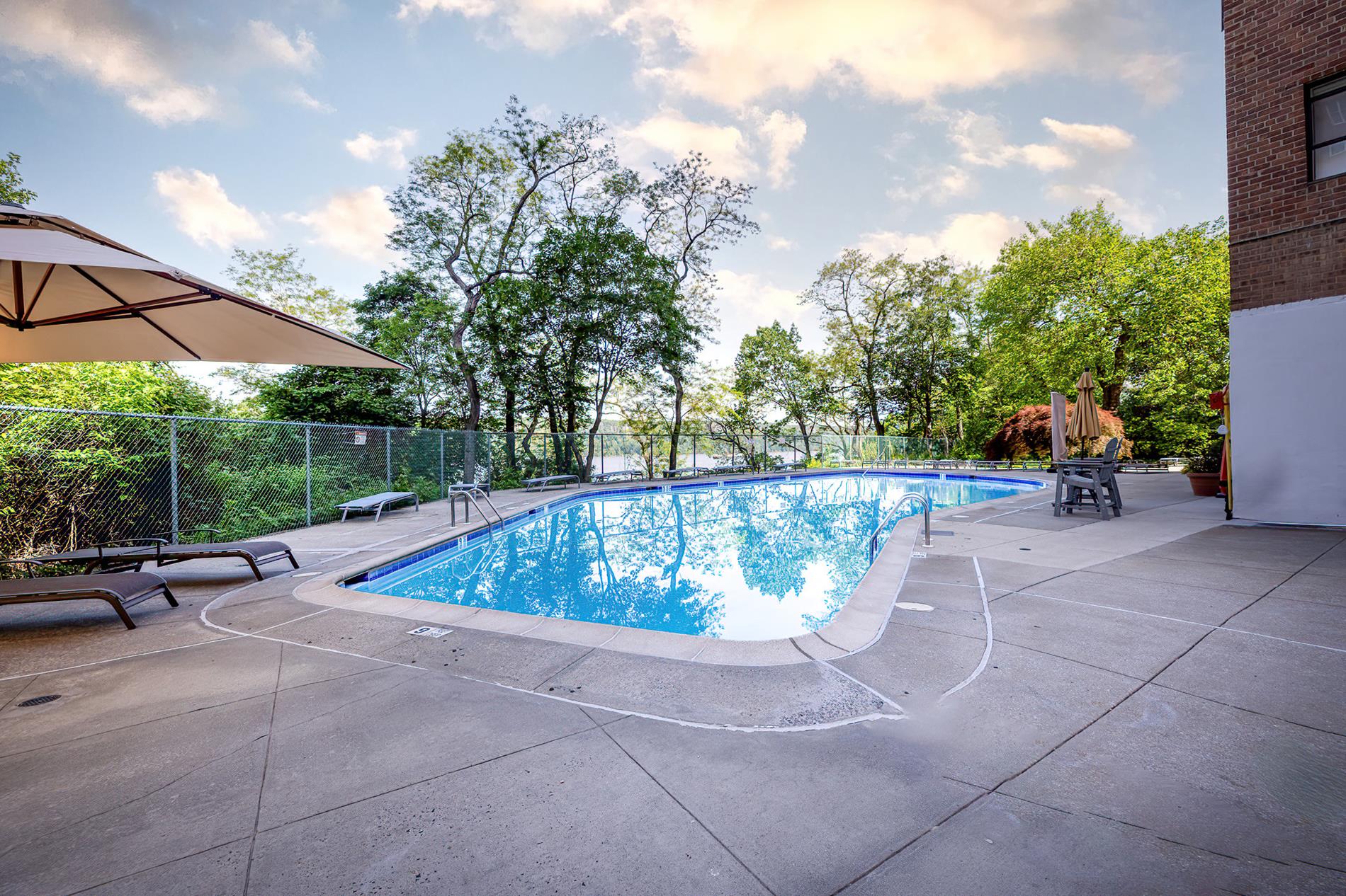 2727 Palisade Avenue, Unit 7B Bronx, NY 10463 - Photo 19 of 22 a view of a swimming pool with a patio