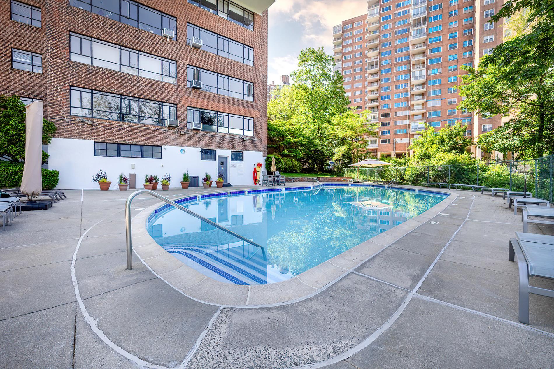 2727 Palisade Avenue, Unit 7B Bronx, NY 10463 - Photo 20 of 22 a view of a swimming pool with a patio