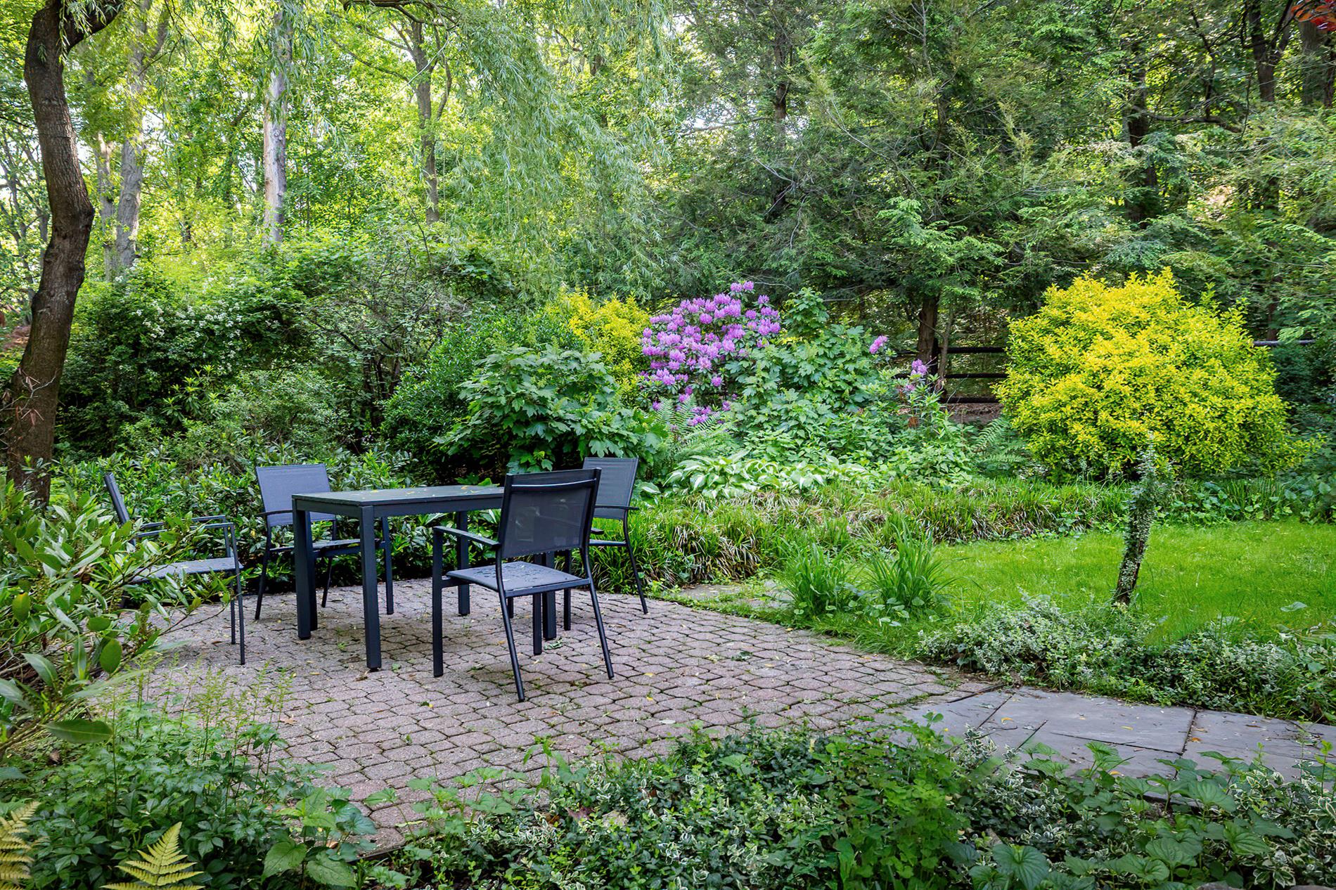2727 Palisade Avenue, Unit 7B Bronx, NY 10463 - Photo 3 of 22 a view of chair and table in the garden