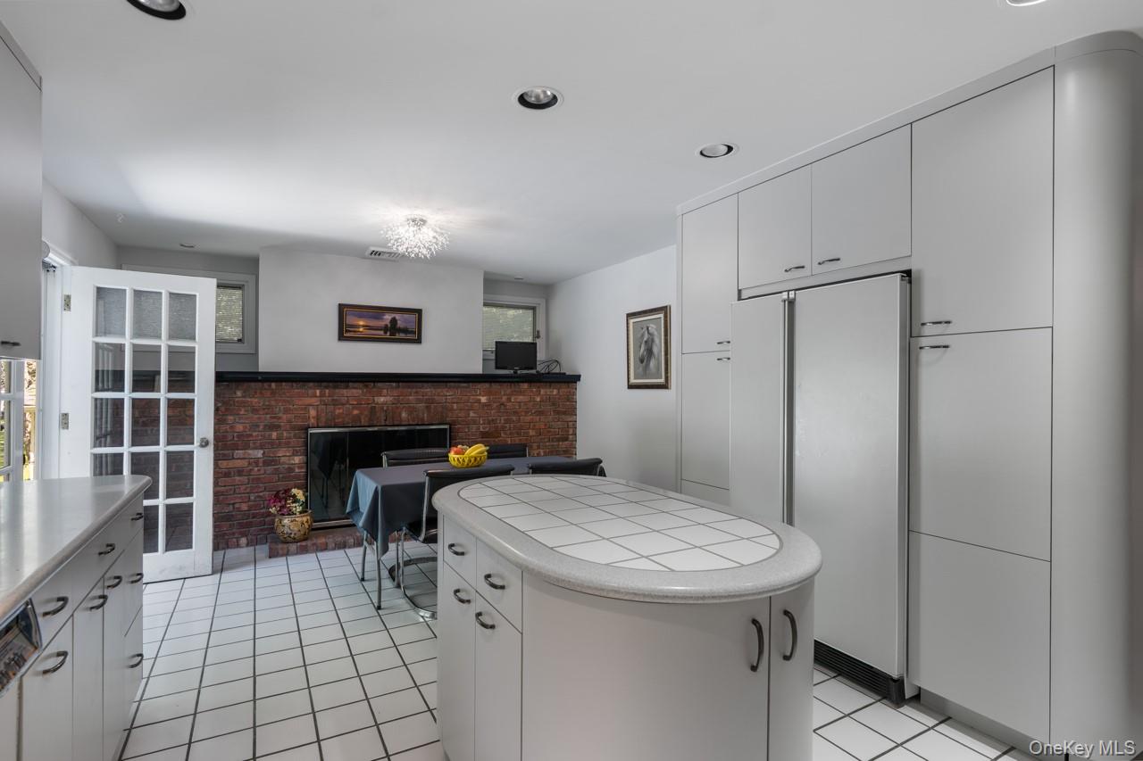 185 Taylor Road Mountainville, NY 10953 - Photo 23 of 47 Brick, wood-burning fireplace in the eat-in area of the kitchen