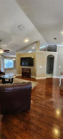 a room with a bed and window