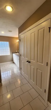 a bathroom with a glass shower door