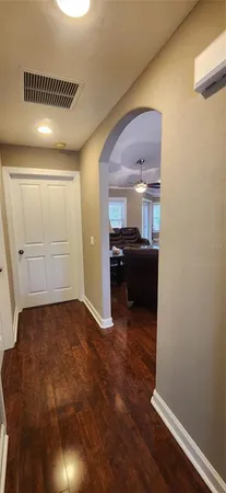 a kitchen with granite countertop a stove a microwave a sink and cabinets