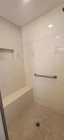 a bathroom with a bathtub and a sink