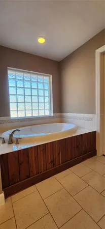 a bathroom with a granite countertop sink mirror and vanity