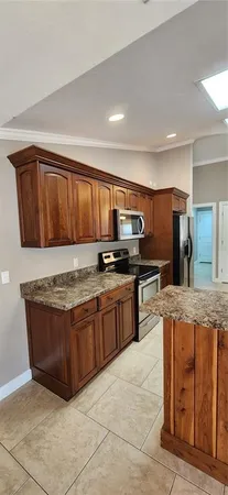 a utility room with cabinets washer and dryer