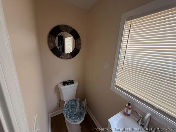 a bathroom with a toilet and a sink