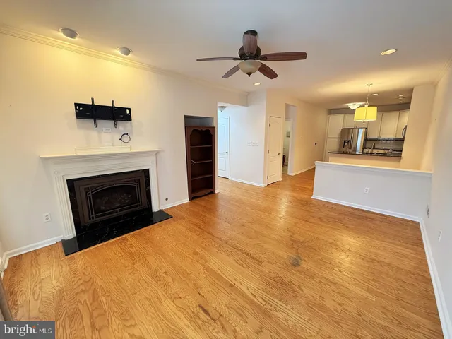 a view of an empty room with a fireplace
