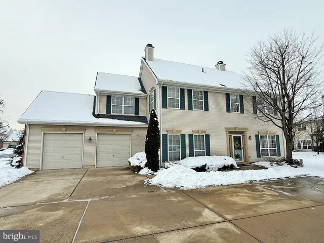 a view of a white house with a outdoor space