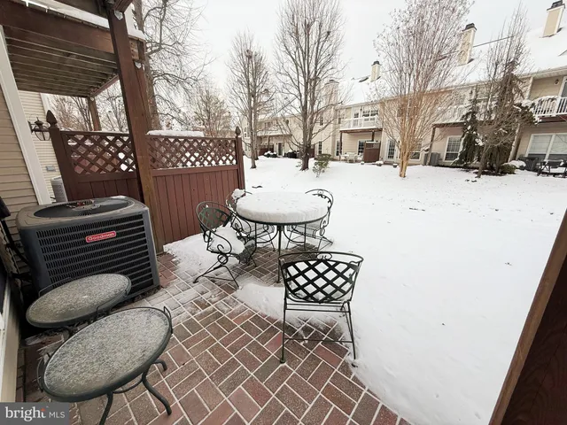 a view of a chairs and table in backyard