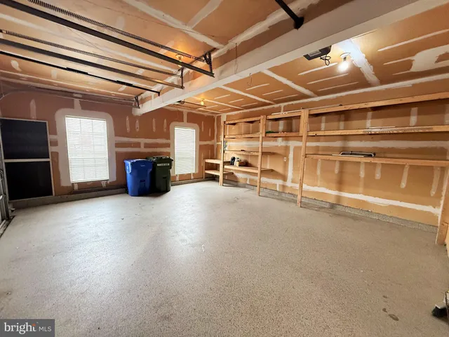 a view of an empty room with a fireplace