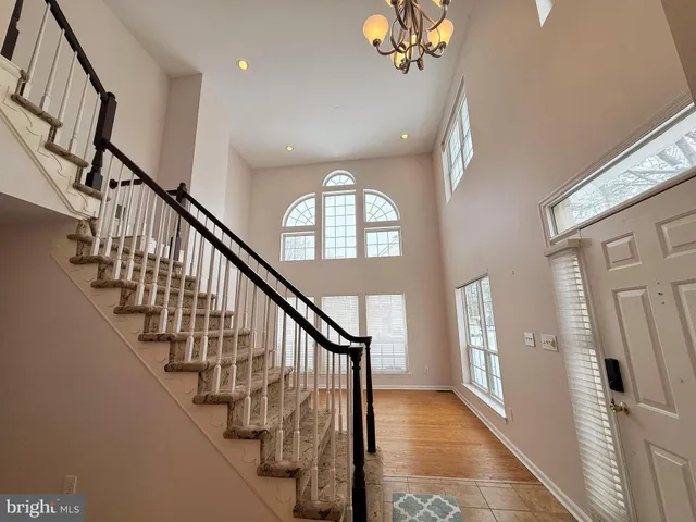 a view of an entryway wooden floor and a front door