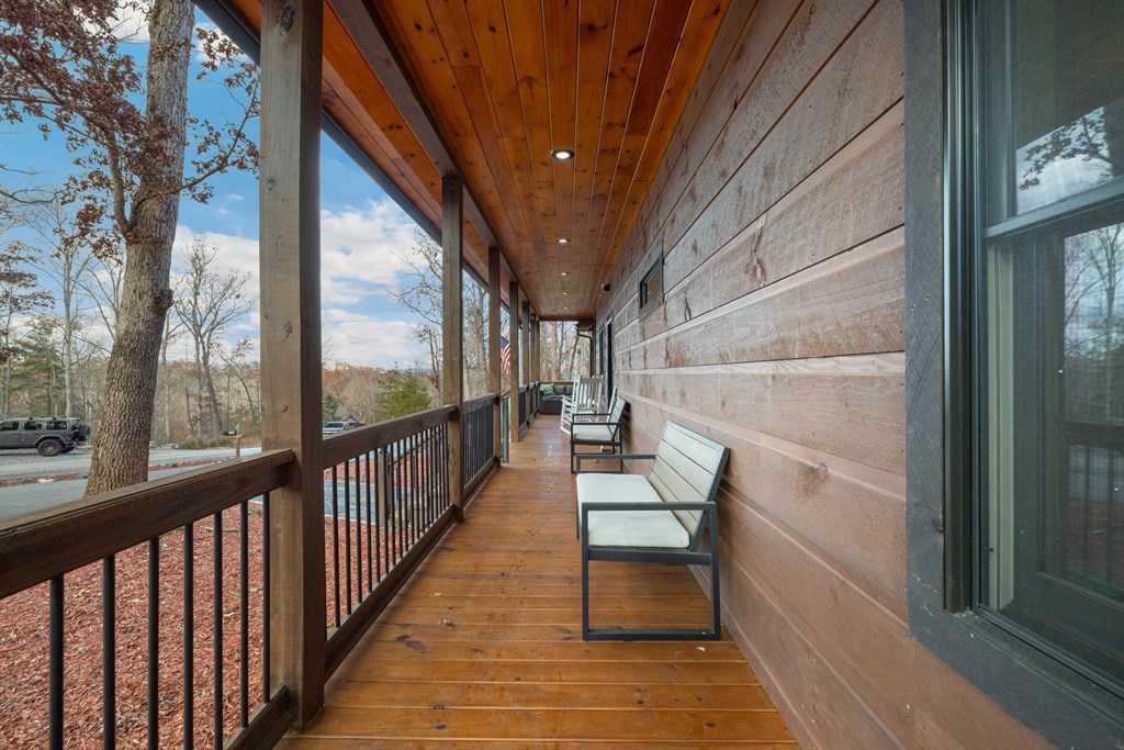 135 Grayson Point Blue Ridge, GA 30513 - Photo 3 of 46 a view of balcony with wooden floor and outdoor seating