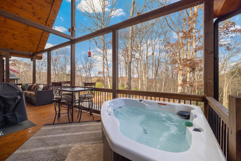 135 Grayson Point Blue Ridge, GA 30513 - Photo 35 of 46 a living room with furniture and a floor to ceiling window