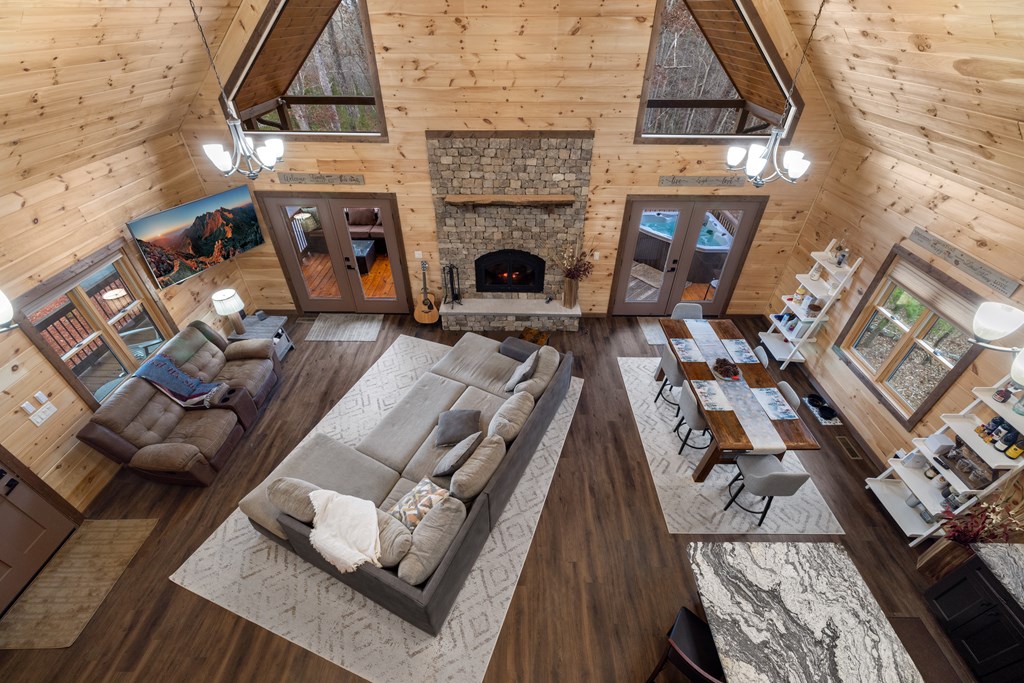 135 Grayson Point Blue Ridge, GA 30513 - Photo 5 of 46 a living room with furniture and a fireplace