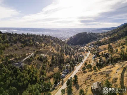 an aerial view of city and mountain