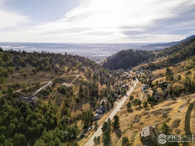an aerial view of city and mountain