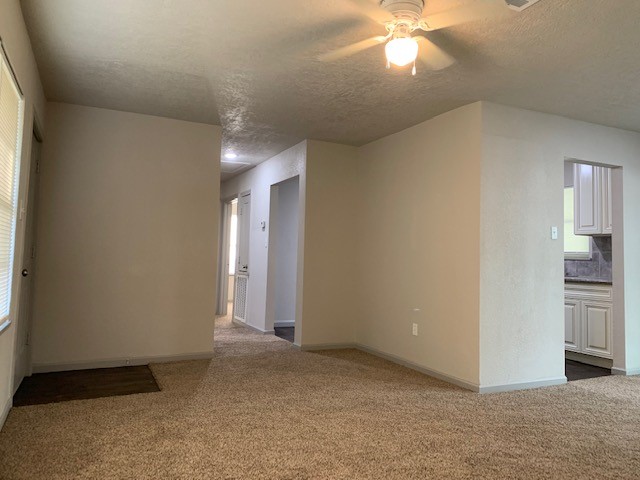 5244 Enyart Street Houston, TX 77021 - Photo 2 of 12 an empty room with closet and a ceiling fan