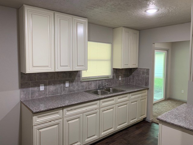 5244 Enyart Street Houston, TX 77021 - Photo 3 of 12 a kitchen with sink cabinets and window