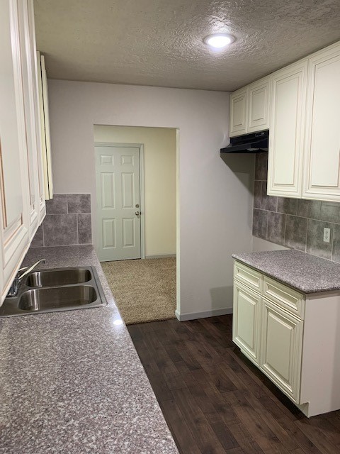 5244 Enyart Street Houston, TX 77021 - Photo 4 of 12 a kitchen that has a sink and a stove in it