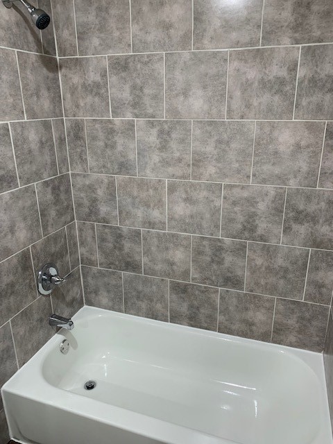 5244 Enyart Street Houston, TX 77021 - Photo 10 of 12 a white bath tub and a shower