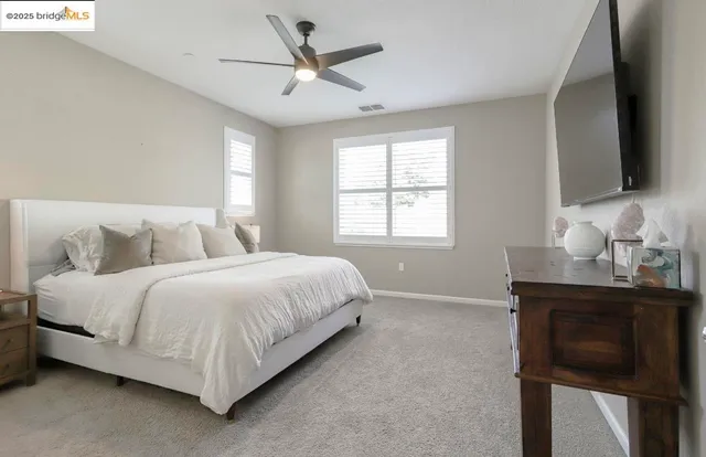 an aerial view of a golf course with a lake view