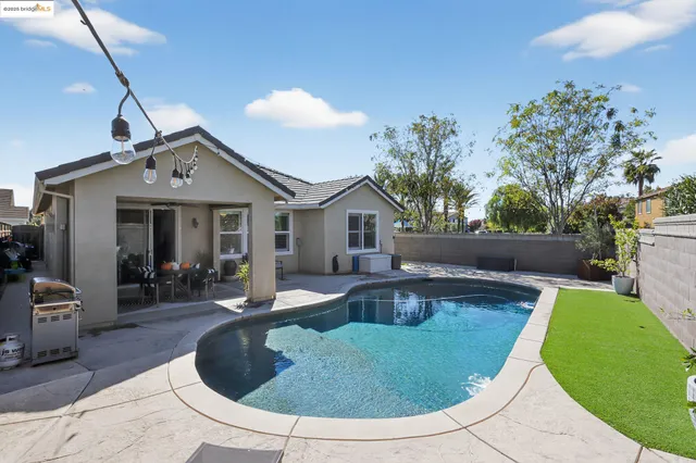 a view of a dining room with furniture and window
