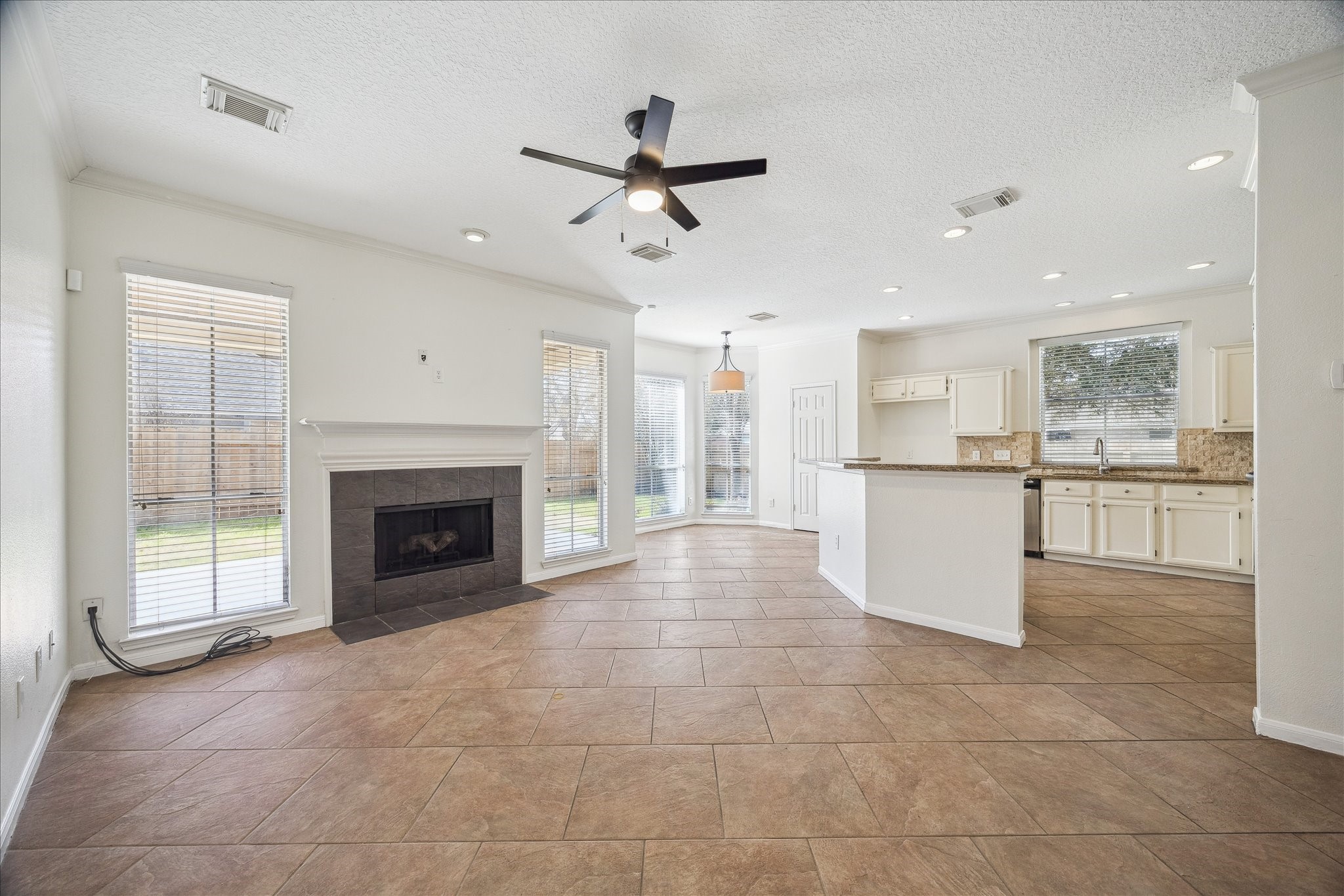 12831 Dove Point Lane Houston, TX 77041 - Photo 16 of 50 a view of a kitchen with an empty space and a kitchen