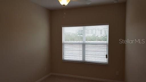 7652 Ripplepointe Way Windermere, FL 34786 - Photo 13 of 21 a view of an empty room with a window
