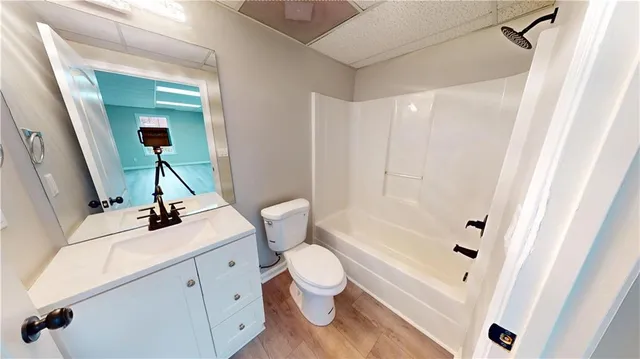 a view of a room with wooden floor