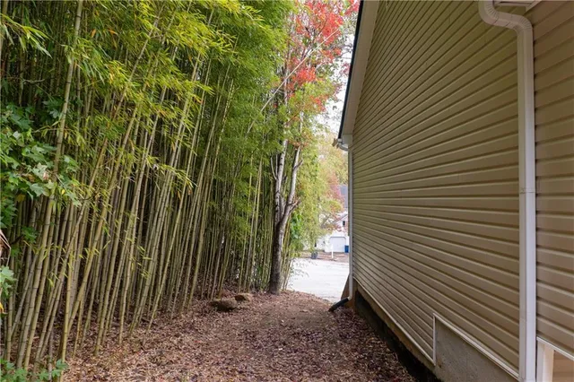 a view of a house with a yard and sitting area