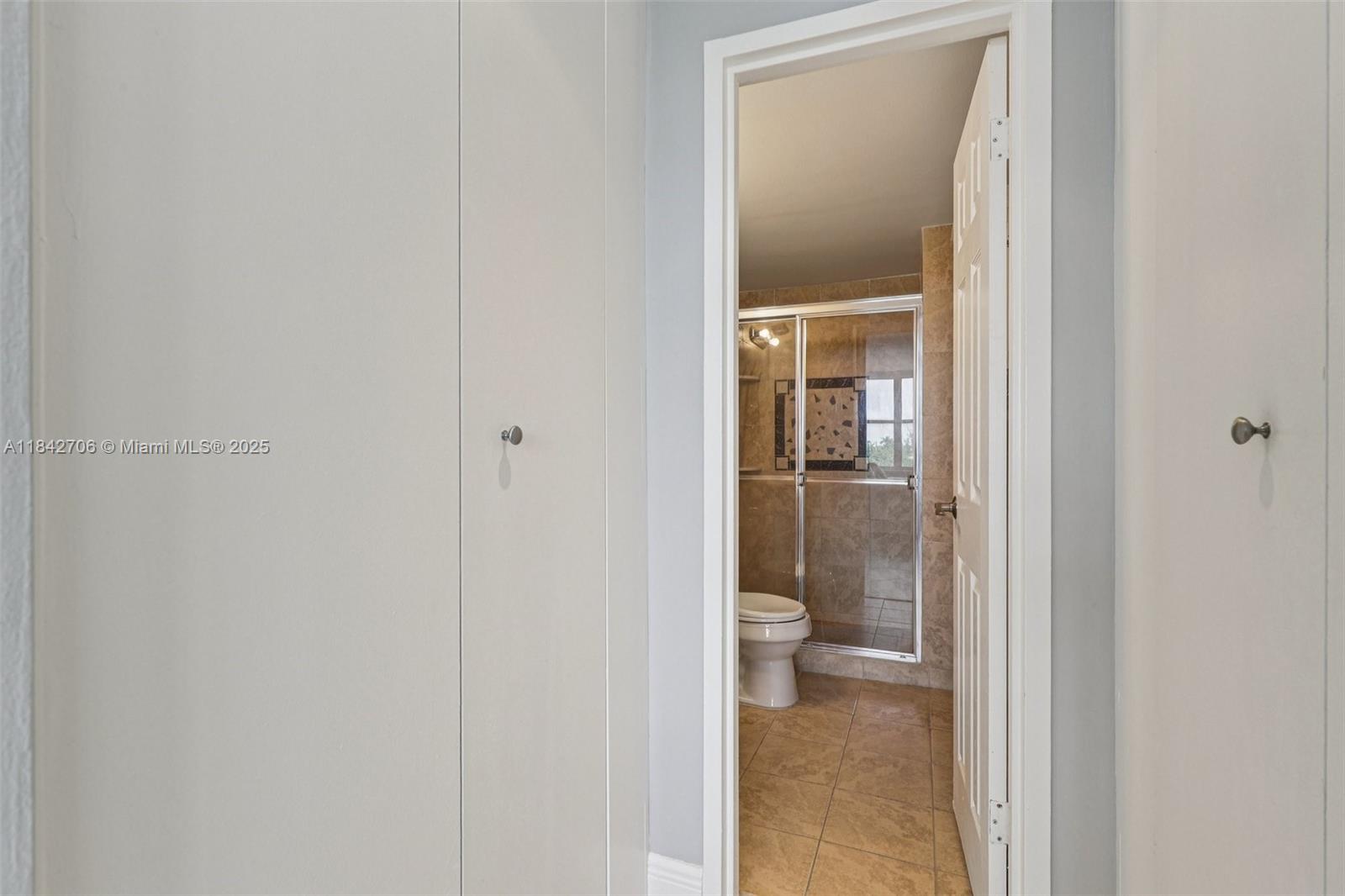 7441 Wayne Avenue, Unit 2B Miami Beach, FL 33141 - Photo 24 of 30 a bathroom view of a toilet and a sink