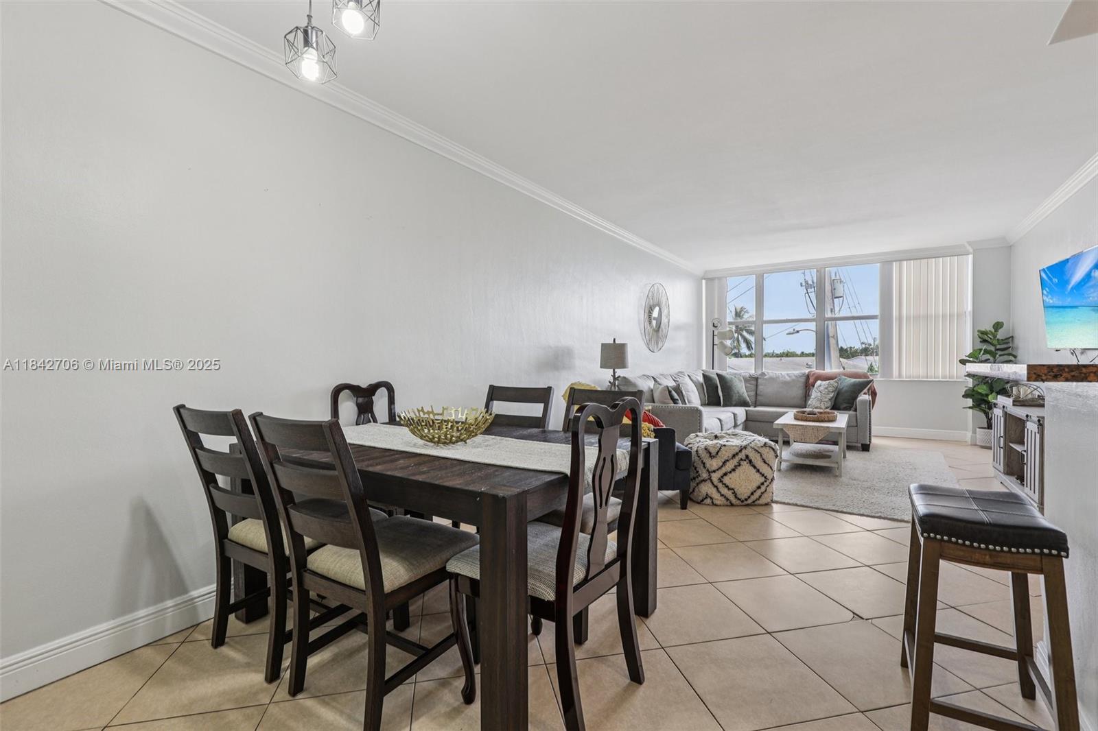 7441 Wayne Avenue, Unit 2B Miami Beach, FL 33141 - Photo 7 of 30 a view of a dining room with furniture