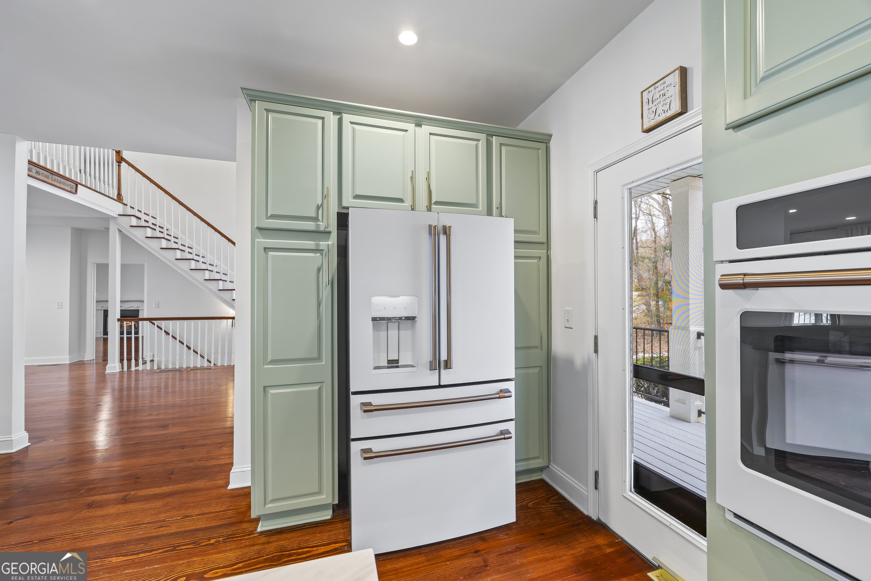 1270 Swords Road Greensboro, GA 30642 - Photo 12 of 44 a view of a hallway with wooden floor and staircase