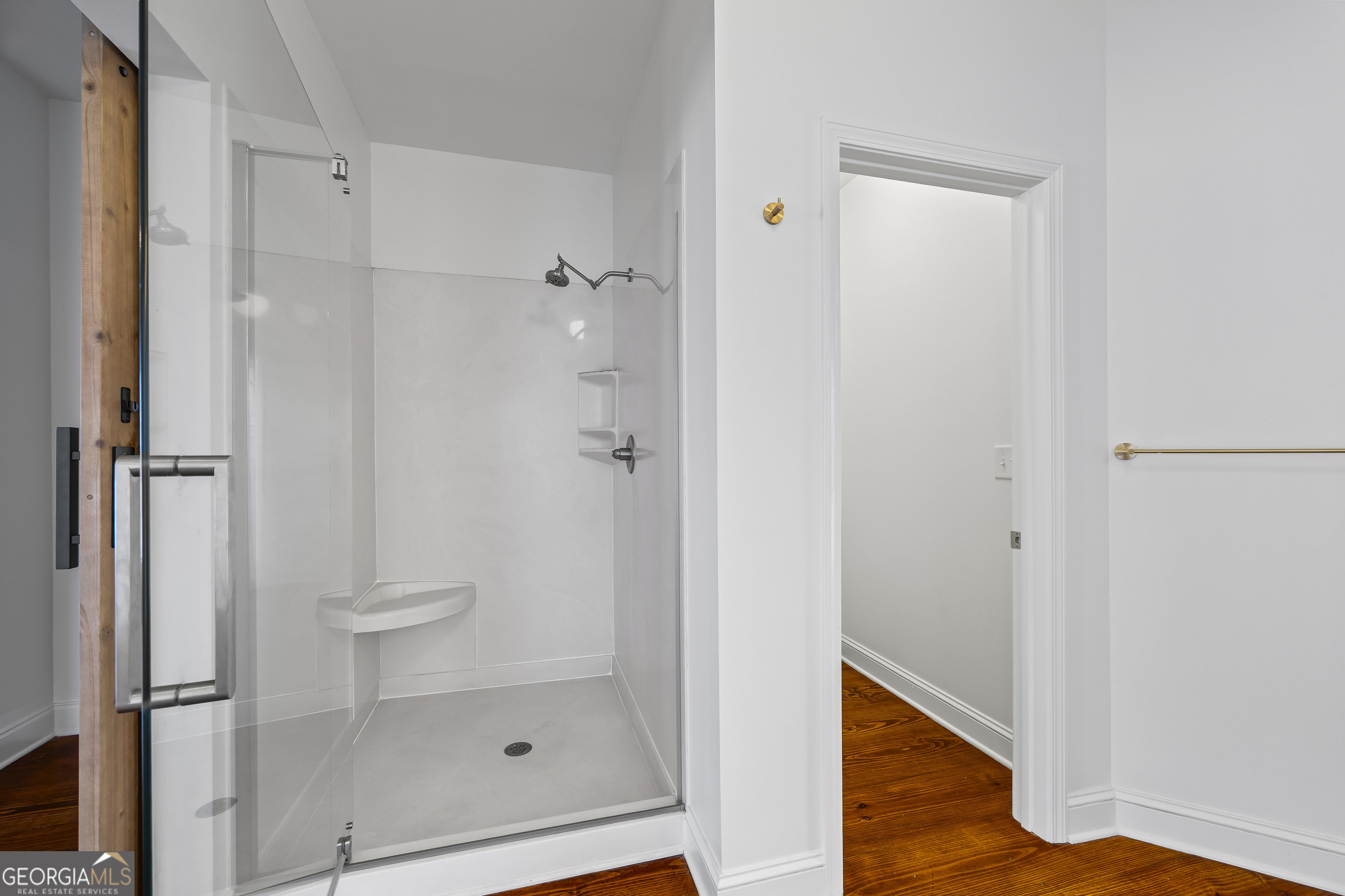 1270 Swords Road Greensboro, GA 30642 - Photo 23 of 44 a bathroom with a glass shower door