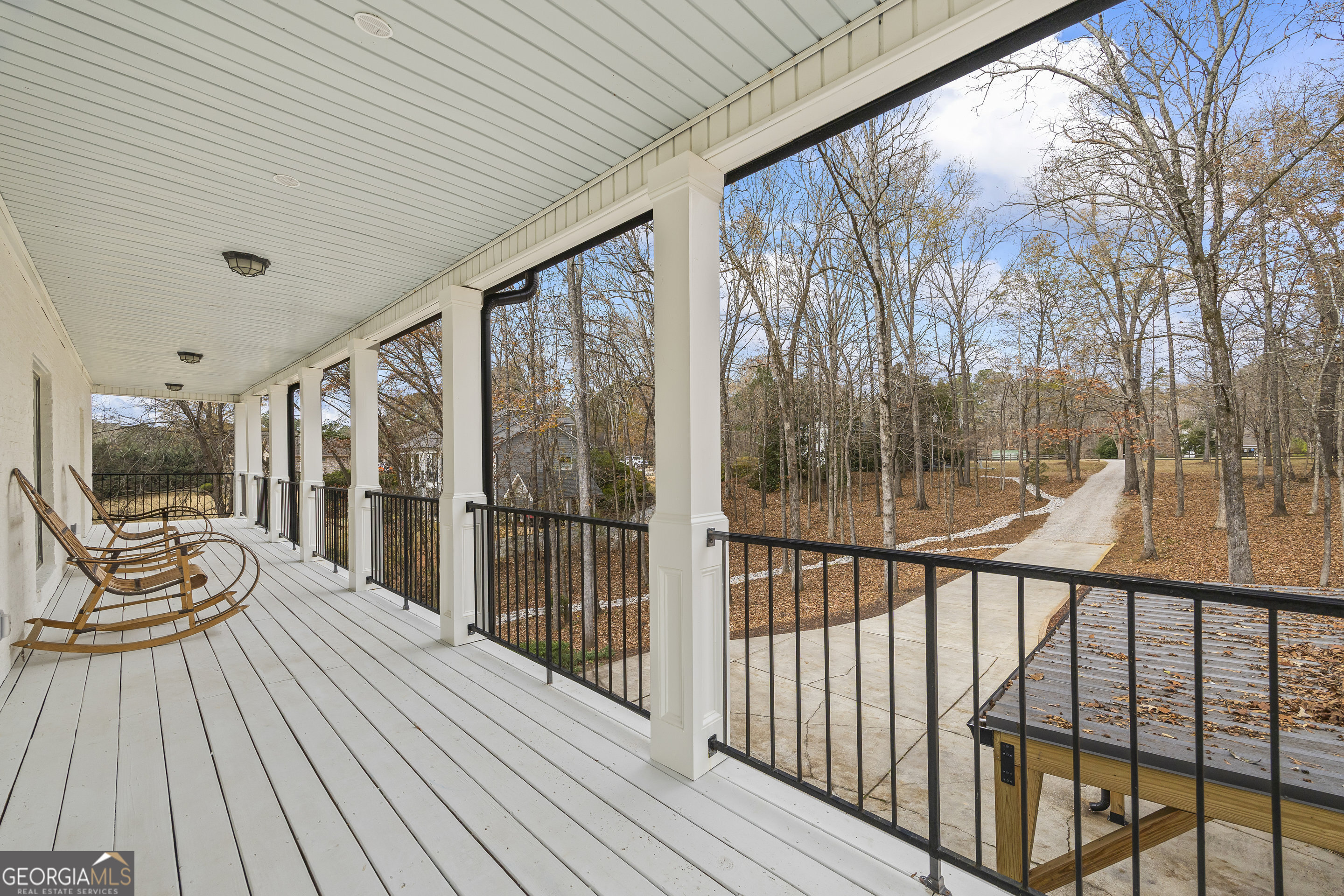 1270 Swords Road Greensboro, GA 30642 - Photo 24 of 44 a view of a balcony with chairs and wooden floor