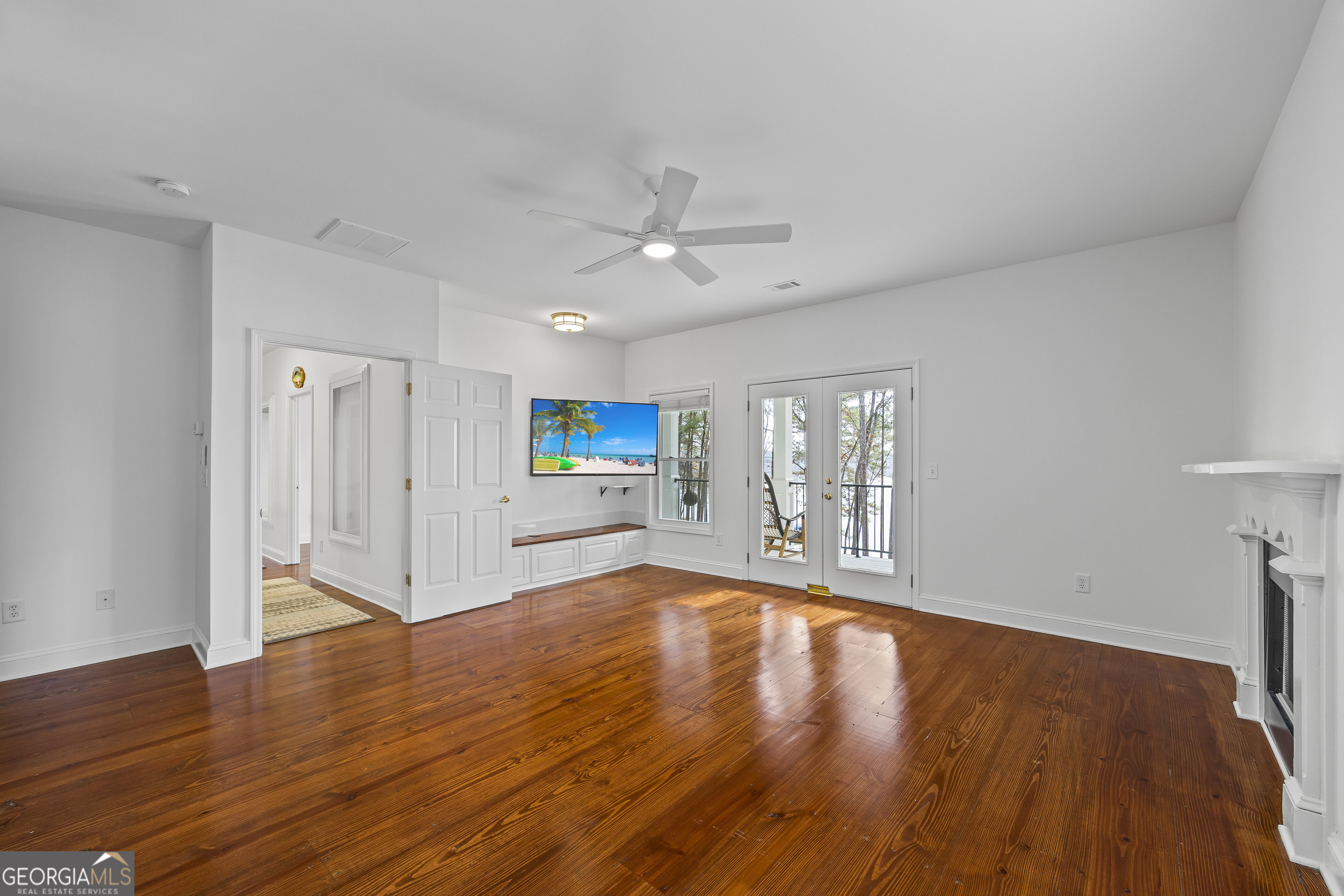 1270 Swords Road Greensboro, GA 30642 - Photo 29 of 44 a view of an empty room with window and wooden floor