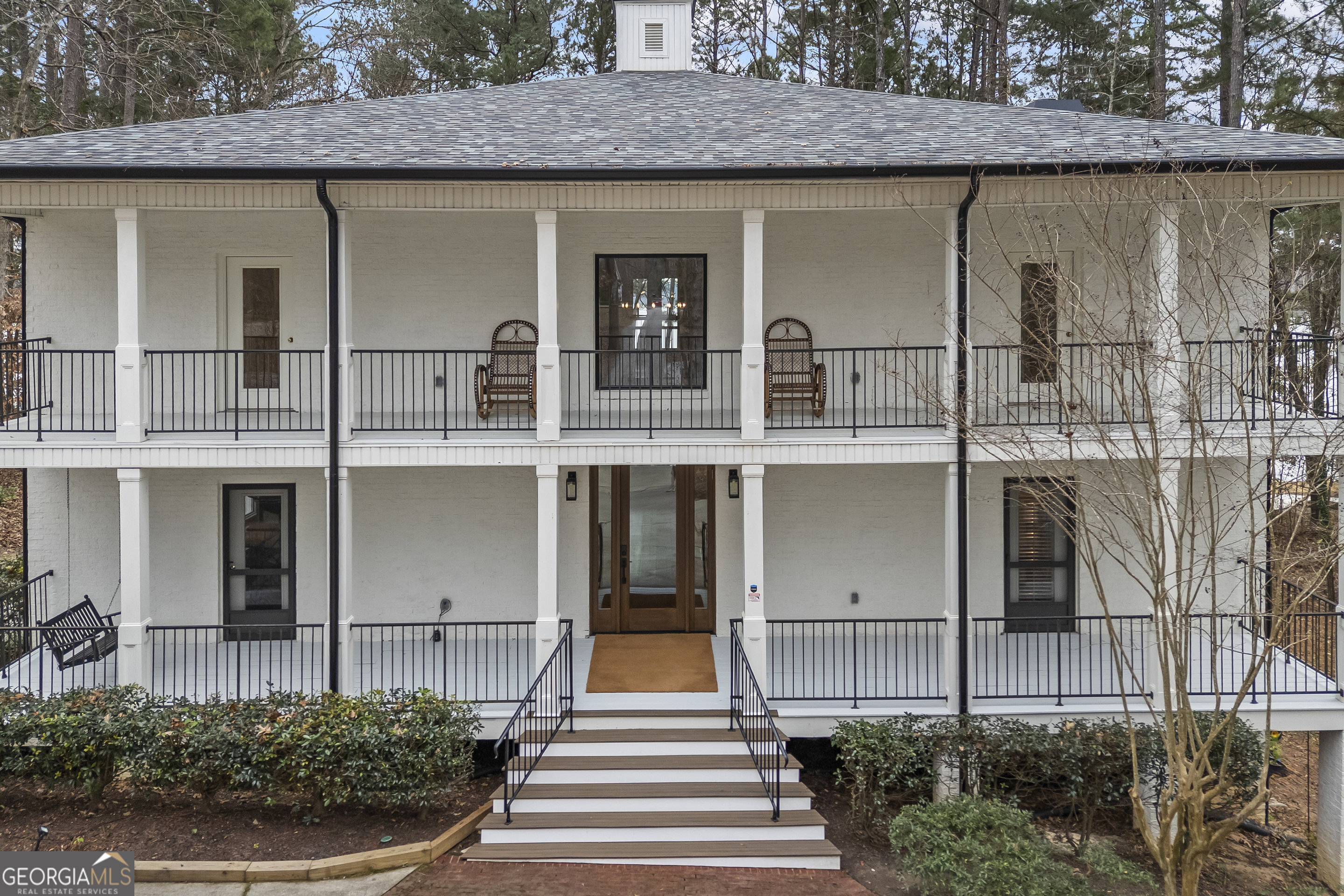 1270 Swords Road Greensboro, GA 30642 - Photo 4 of 44 a front view of a house with a garden