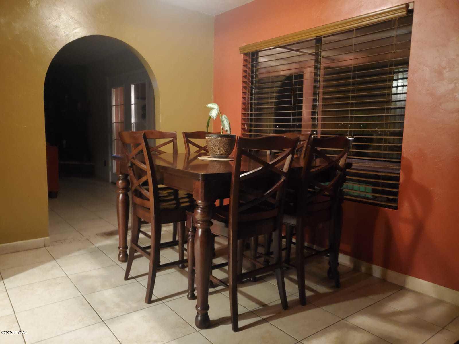 1186 Avenida Leon Rio Rico, AZ 85648 - Photo 18 of 31 a view of a dinning table and chairs in patio