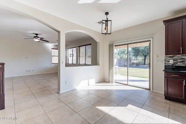 a kitchen with granite countertop stainless steel appliances and cabinets