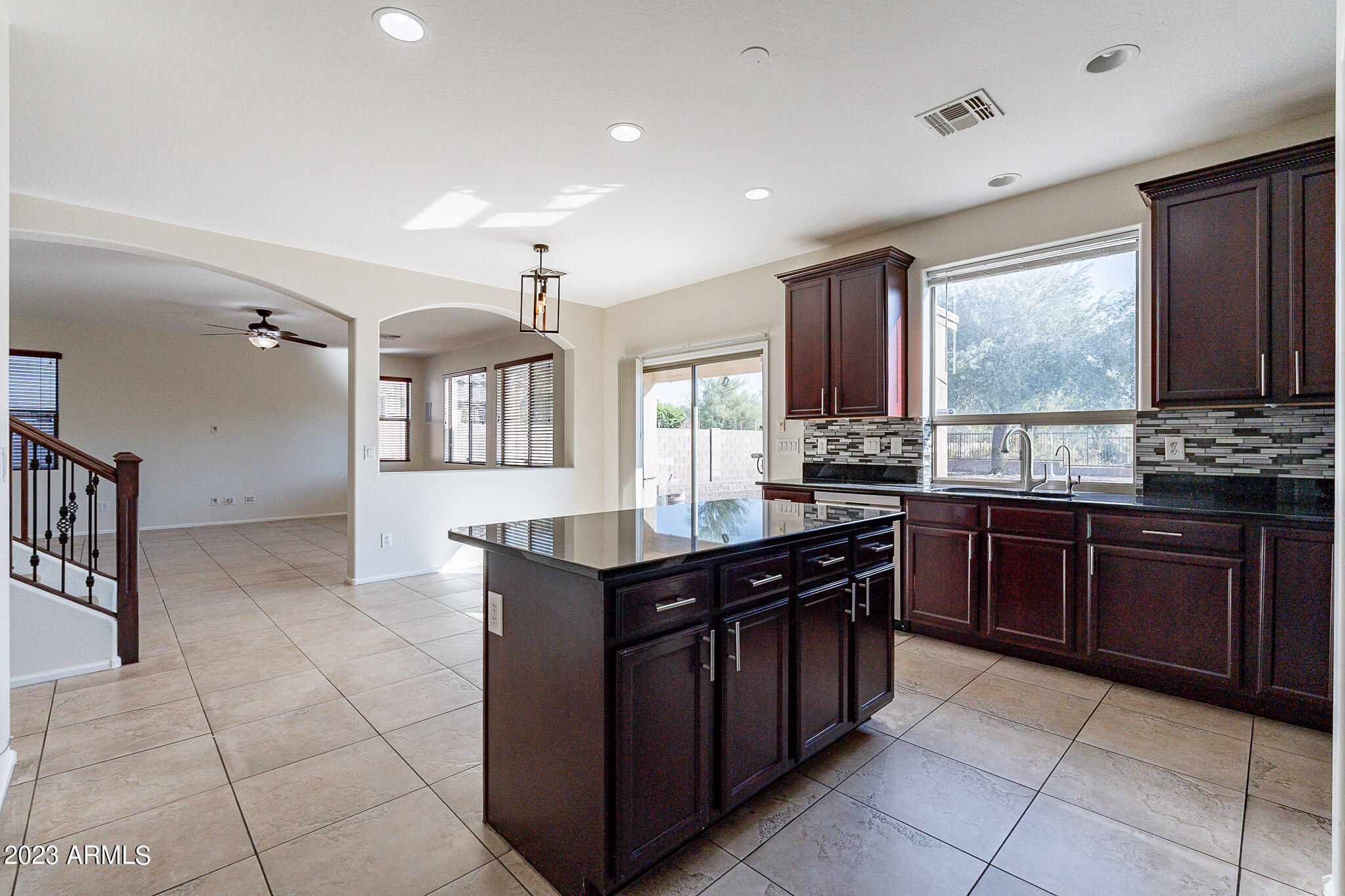 2943 East Quiet Hollow Lane Phoenix, AZ 85024 - Photo 20 of 65 a kitchen with stainless steel appliances granite countertop a stove a sink and a refrigerator